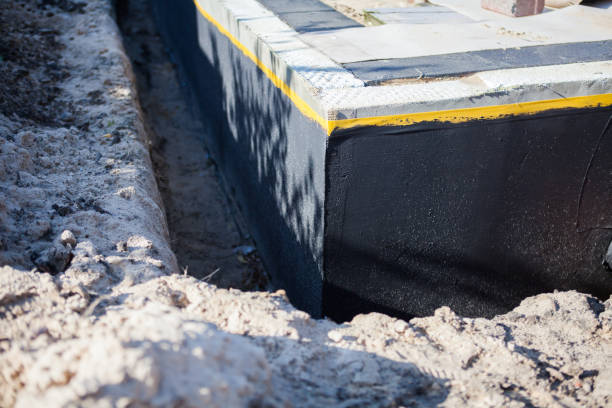 Professional Waterproofing technician working in Manitowoc, WI